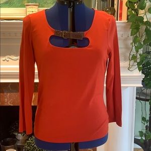 Long sleeved coral top with buckle detail